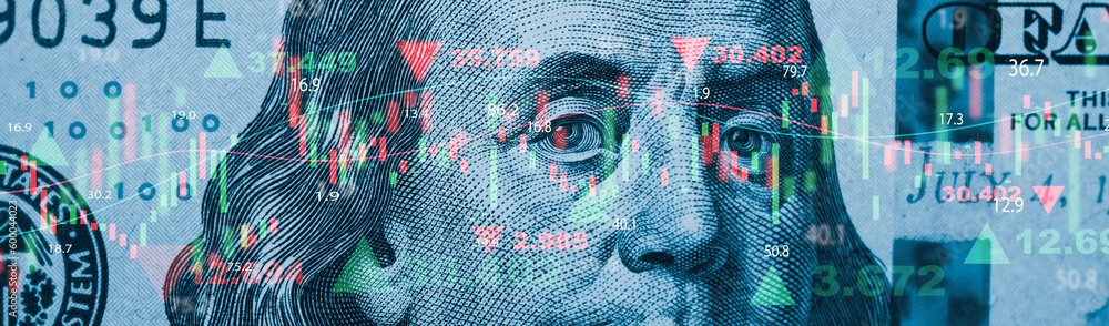 Closeup Benjamin Franklin face on USD banknote with stock market chart graph for currency exchange and global trade forex concept.